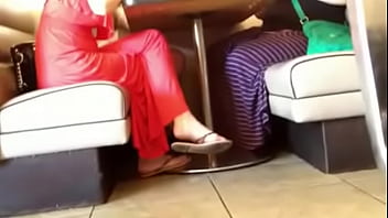 3445695 cuties feet and soles at restaurant.