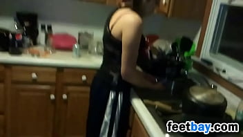 Housewife Shows Off Her Feet In The Kitchen