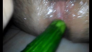Anal playing with a cucumber