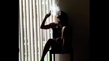 beautiful woman smokes cigar (woman smoke cigar)