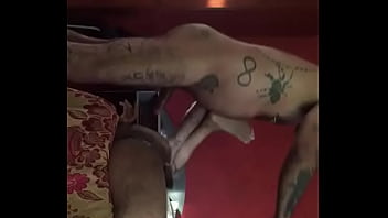 gay moaning on the tattooed male's cock