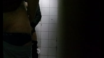 Guy sucking each other in the bathroom