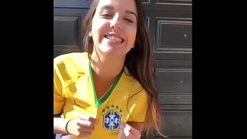 Very hot young girl in short shorts wearing the Brazilian national team shirt