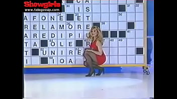 Simona Tagli - Crossword clue with a red dress