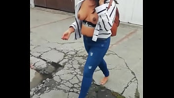 Colombian barefoot puta showing tits in public in the street