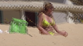 Lady with yellow bikini at the beach