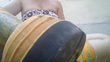 Lick my yellow boots completely dirty with green mud while I'm in the garden