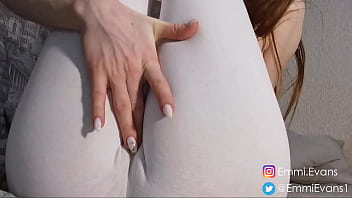 In white leggings and socks, she shows her legs and tits