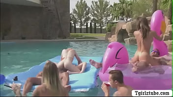 Busty shemales enjoy their orgy in pool