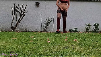 La Gourmande has a big urge to piss, she goes to her garden, keeping only her stockings and her red boots to relieve her bladder with a close-up of her pierced pussy