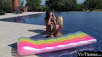 Beautiful lesbians get wet in the pool as well as thier pussies
