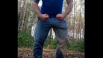 Muscular guy is doing muscle worship and jerking off in forrest