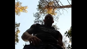 Muscular guy is jerking off and in forrest with cum