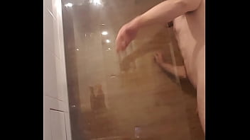 muscular guy is take a shower