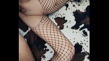 in erotic mesh bodysuit and heels