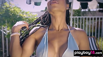 Muscular ebony beauty reveals her huge fake boobs outdoor